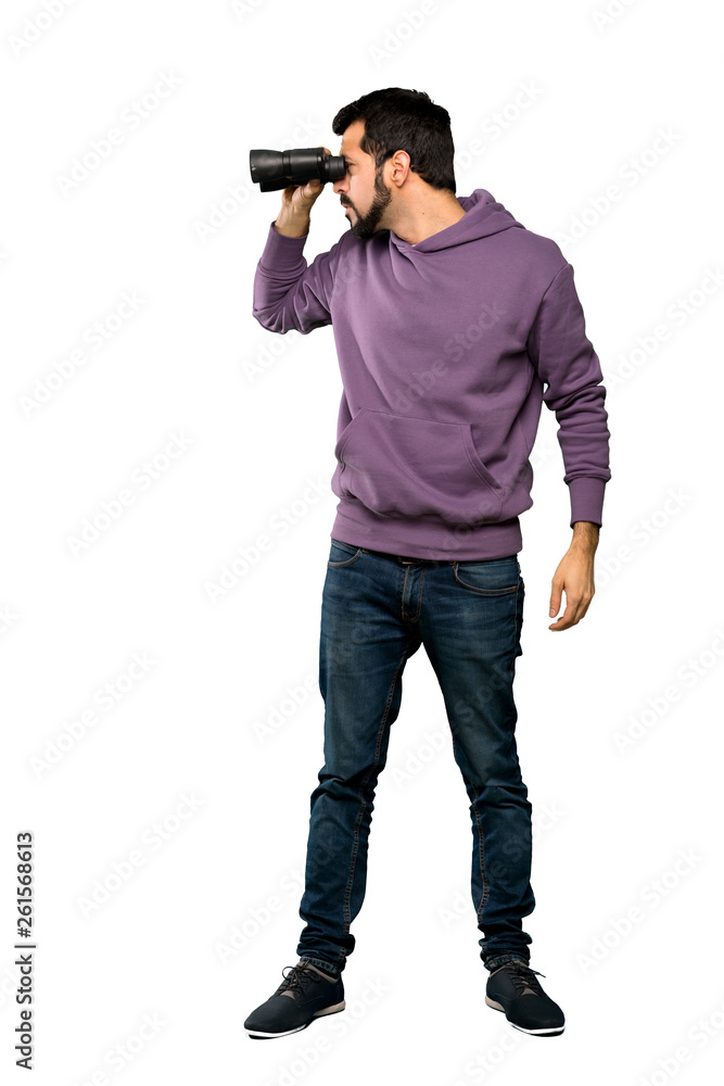 Handsome man with sweatshirt with binoculars Handsome man with sweatshirt with binoculars