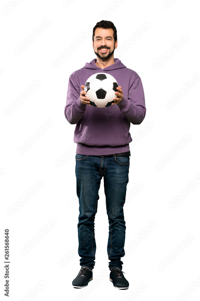 Handsome man with sweatshirt holding a soccer ball
