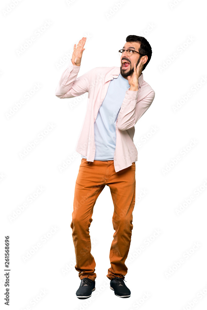Full-length shot of Handsome man with beard nervous and scared over isolated white background Full-length shot of Handsome man with beard nervous and scared over isolated white background