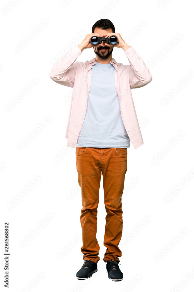 Handsome man with beard with binoculars Handsome man with beard with binoculars