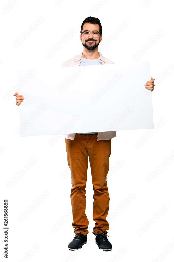 Handsome man with beard holding an empty placard Handsome man with beard holding an empty placard