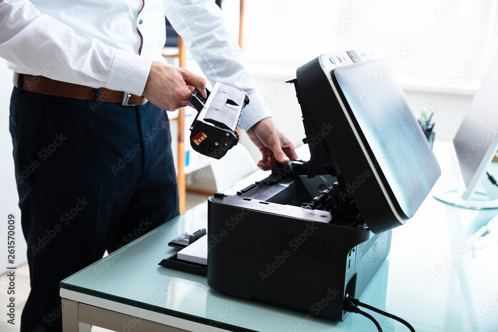 Businessman Fixing Cartridge In Printer Businessman Fixing Cartridge In Printer