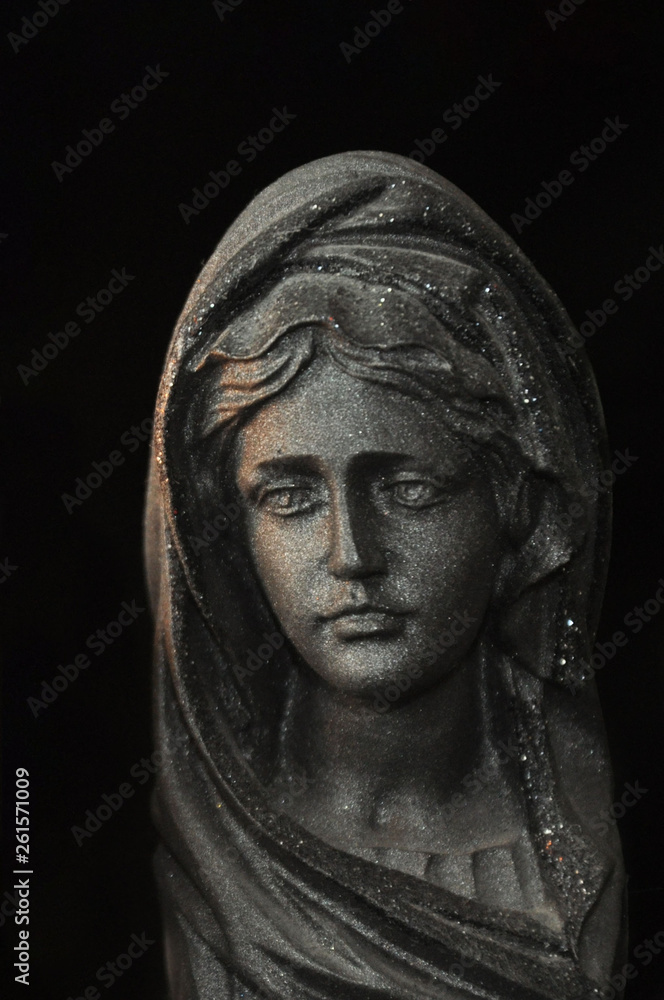 Holy Virgin Mary in the rays of sunlight on a black background. Concept. Holy Virgin Mary in the rays of sunlight on a black background. Concept.