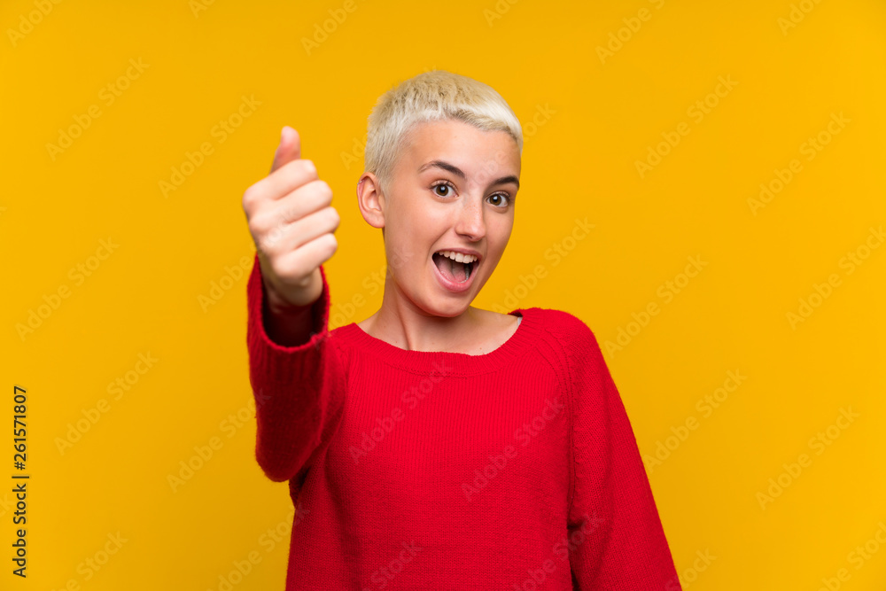 Teenager girl with white short hair over yellow wall inviting to come Teenager girl with white short hair over yellow wall inviting to come