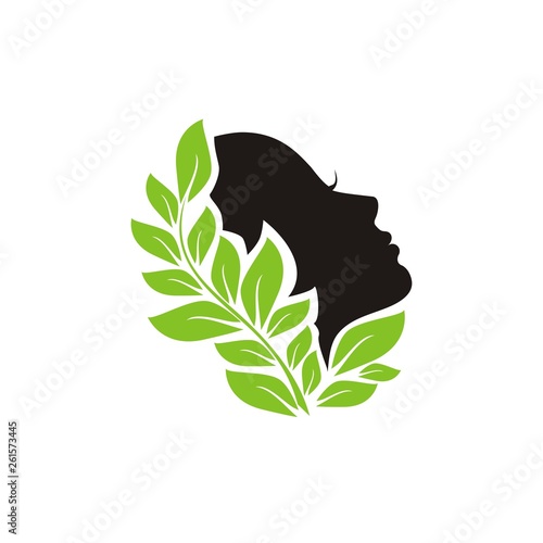 The girl's face in a beautiful pattern of leaves