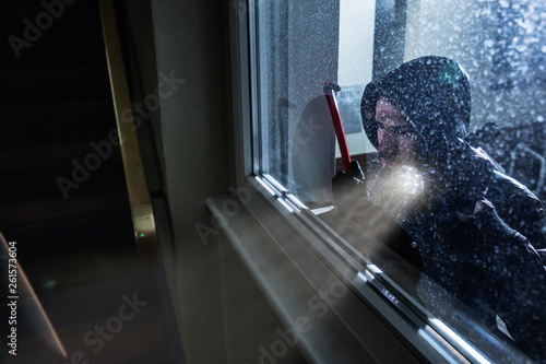 Burglar Looking Into A House Window photo