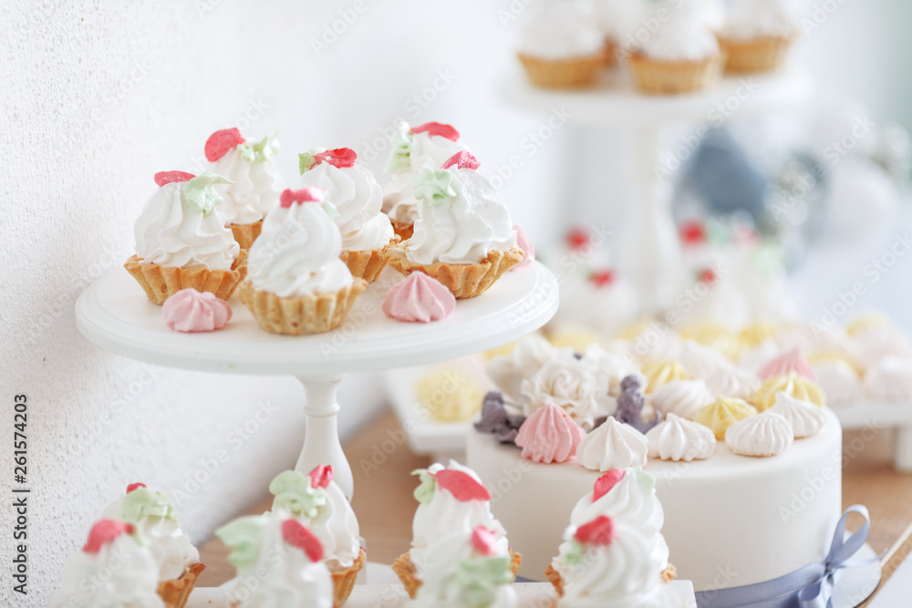 Cakes and sweets on a wooden shelf. The concept of decorating children's holiday. Cakes and sweets on a wooden shelf. The concept of decorating children's holiday.