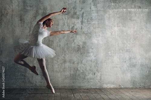 Young beautiful woman ballet dancer, ballerina in white.