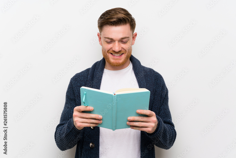Redhead man reading a book Redhead man reading a book