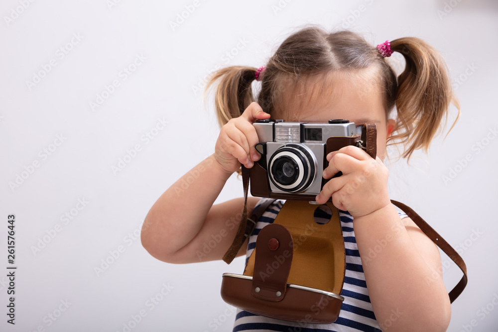 Little Girl Taking Picture Using Photo Camera - obrazy, fototapety, plakaty 