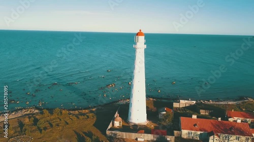 Lighthouse on small island in Baltic sea filmed by drone