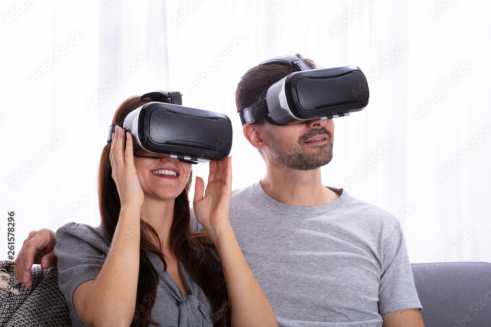 Couple Experiencing Virtual Reality Headset Couple Experiencing Virtual Reality Headset