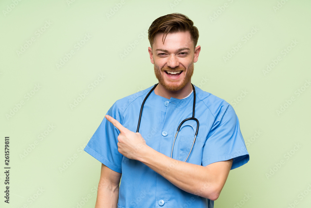 Surgeon doctor man pointing finger to the side Surgeon doctor man pointing finger to the side
