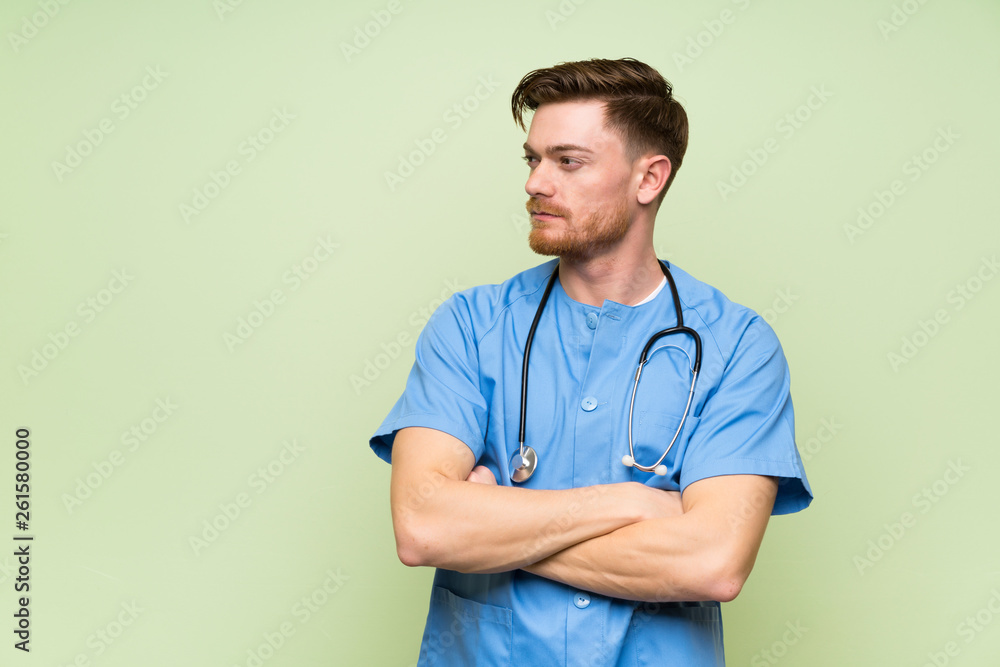Surgeon doctor man standing and looking side Surgeon doctor man standing and looking side