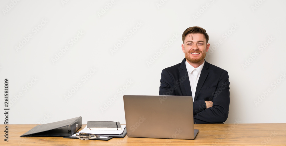 Businessman in a office keeping the arms crossed in frontal position Businessman in a office keeping the arms crossed in frontal position