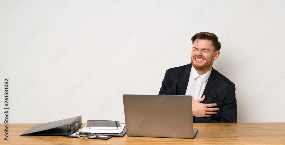 Businessman in a office smiling a lot Businessman in a office smiling a lot