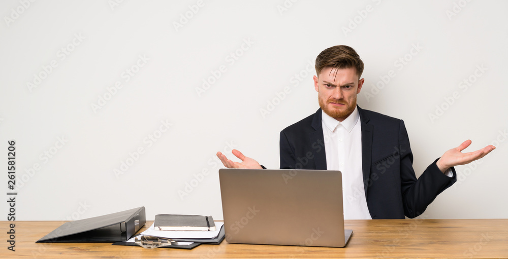 Businessman in a office unhappy for not understand something Businessman in a office unhappy for not understand something