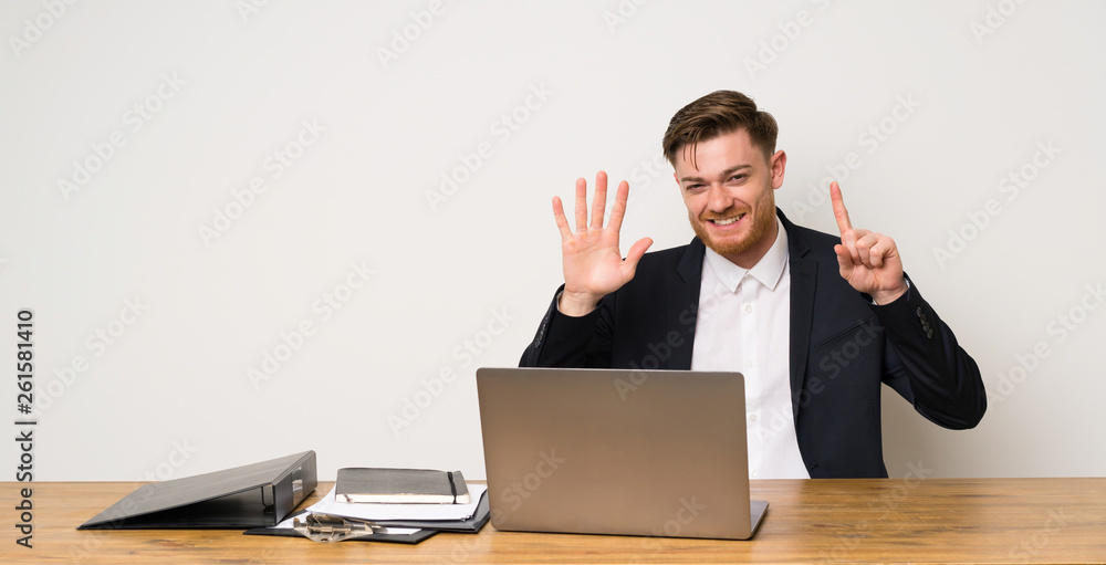 Businessman in a office counting six with fingers Businessman in a office counting six with fingers
