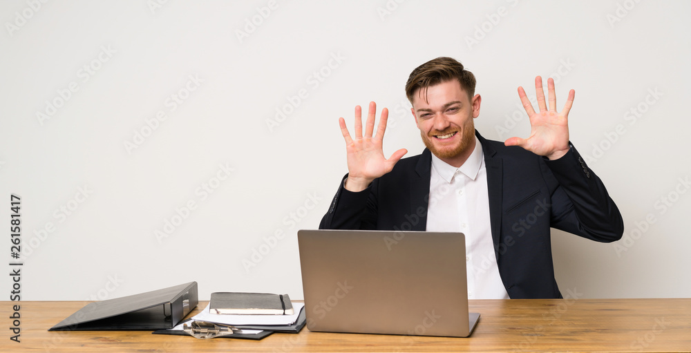 Businessman in a office counting ten with fingers Businessman in a office counting ten with fingers