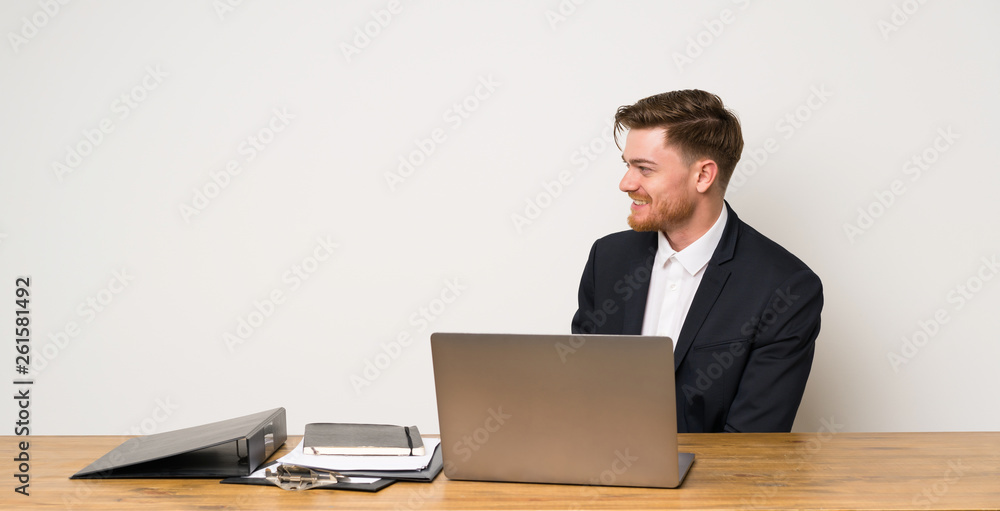 Businessman in a office in lateral position Businessman in a office in lateral position