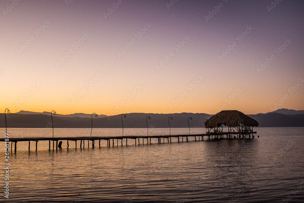 Wooden dock and a rustic hut make up for a beautiful rural pier at the Gulf of Cariaco in Venezuela