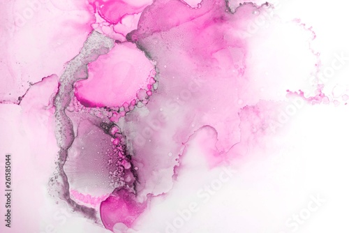 Pink alcohol ink texture with abstract washes and paint stains on the white paper background. 