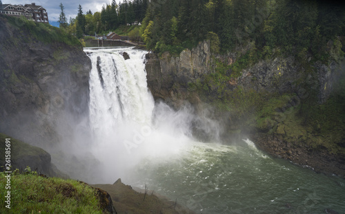 Cascading Waterfall in the US Pacific Northwest with Foggy Evergreen Trees