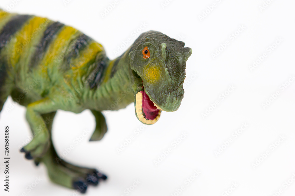 Naklejka premium Dinosaur toy on white background