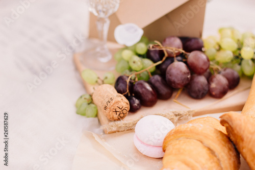grapes, bread and champagne cork
