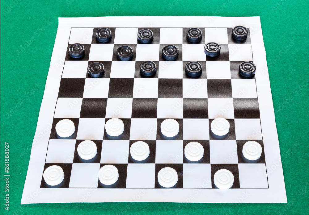 checkers on black and white checkered sheet board checkers on black and white checkered sheet board
