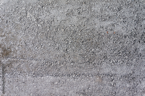 Grungy stone texture of pervious concrete or gravel on construction site photo