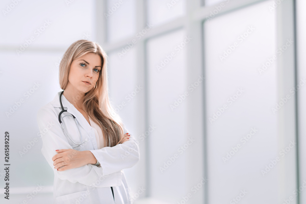 confident female therapist standing by the office window confident female therapist standing by the office window