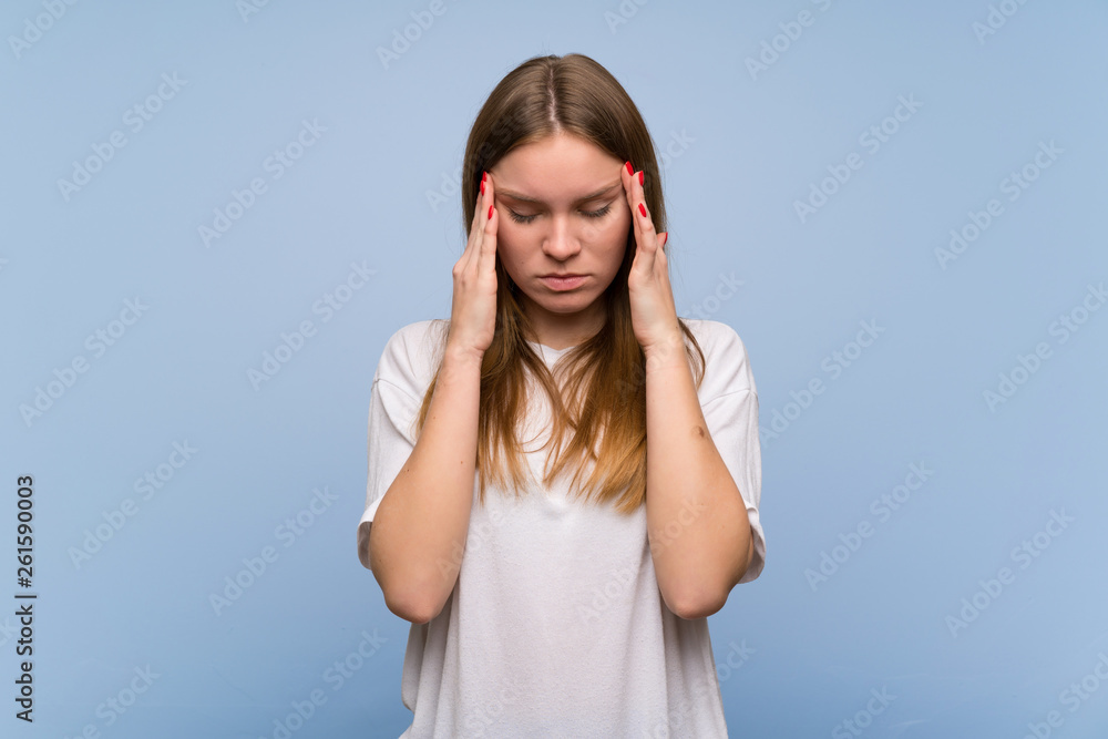 Young woman over blue wall unhappy and frustrated with something Young woman over blue wall unhappy and frustrated with something