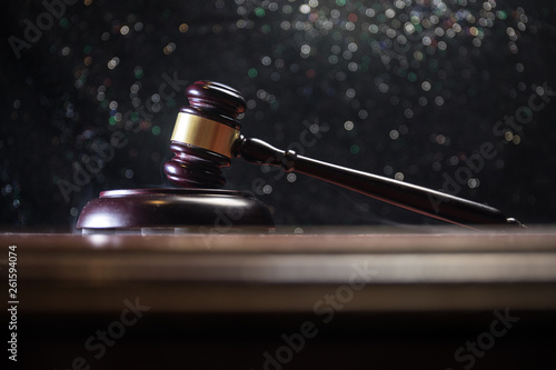 Document with judge on wooden table. Law theme. Selective focus