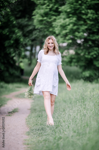 cute pregnant woman on a walk on a summer day © yurolaitsalbert