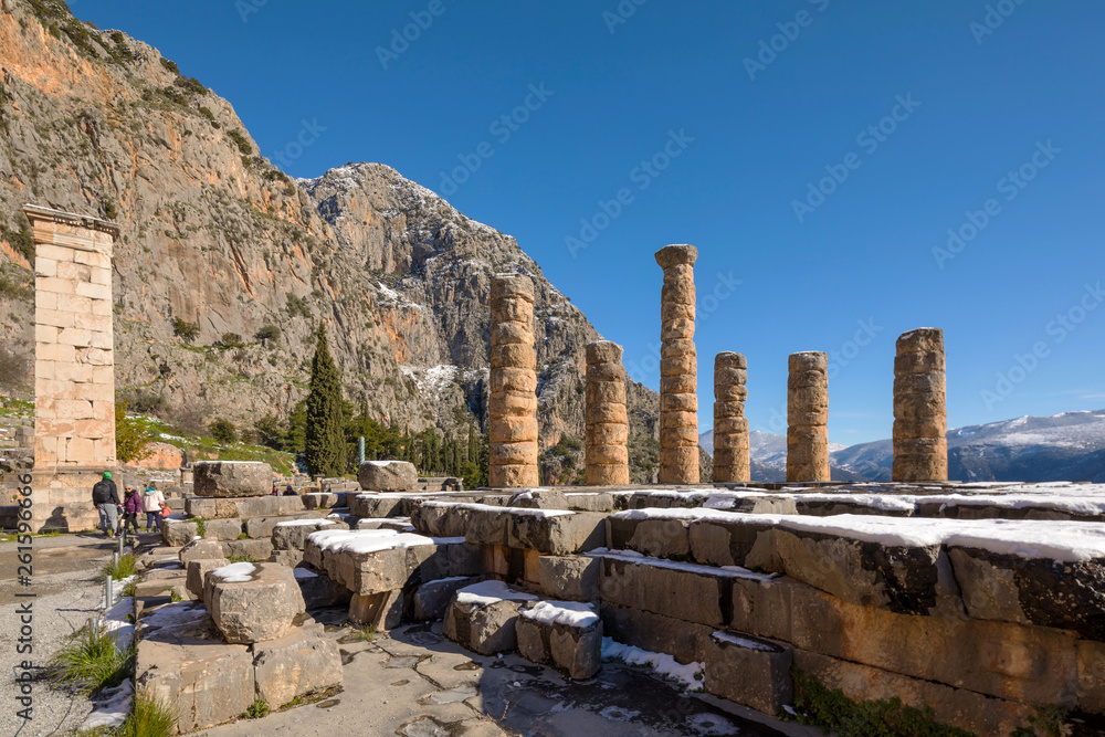 The Apollo temple ruins with snow in Delphi, Greece