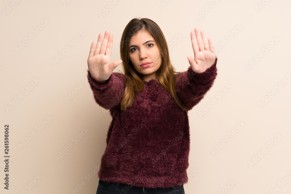 Young girl making stop gesture and disappointed Young girl making stop gesture and disappointed