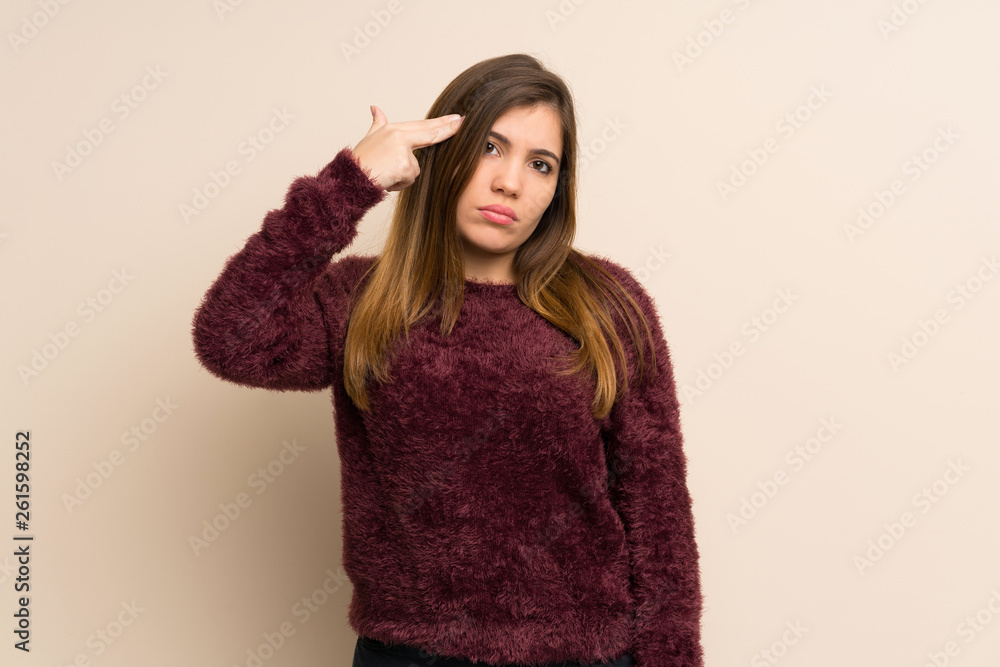 Young girl with problems making suicide gesture Young girl with problems making suicide gesture