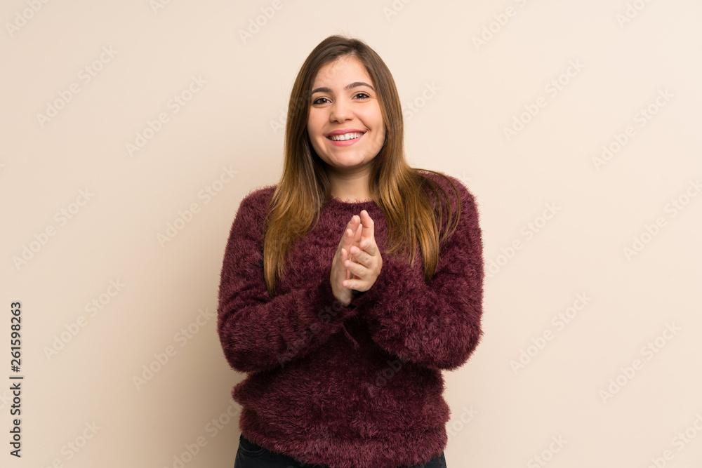 Young girl applauding after presentation in a conference Young girl applauding after presentation in a conference