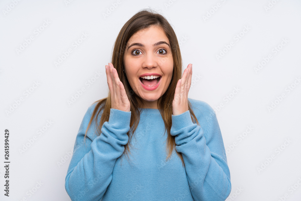 Young girl with blue sweater with surprise facial expression Young girl with blue sweater with surprise facial expression