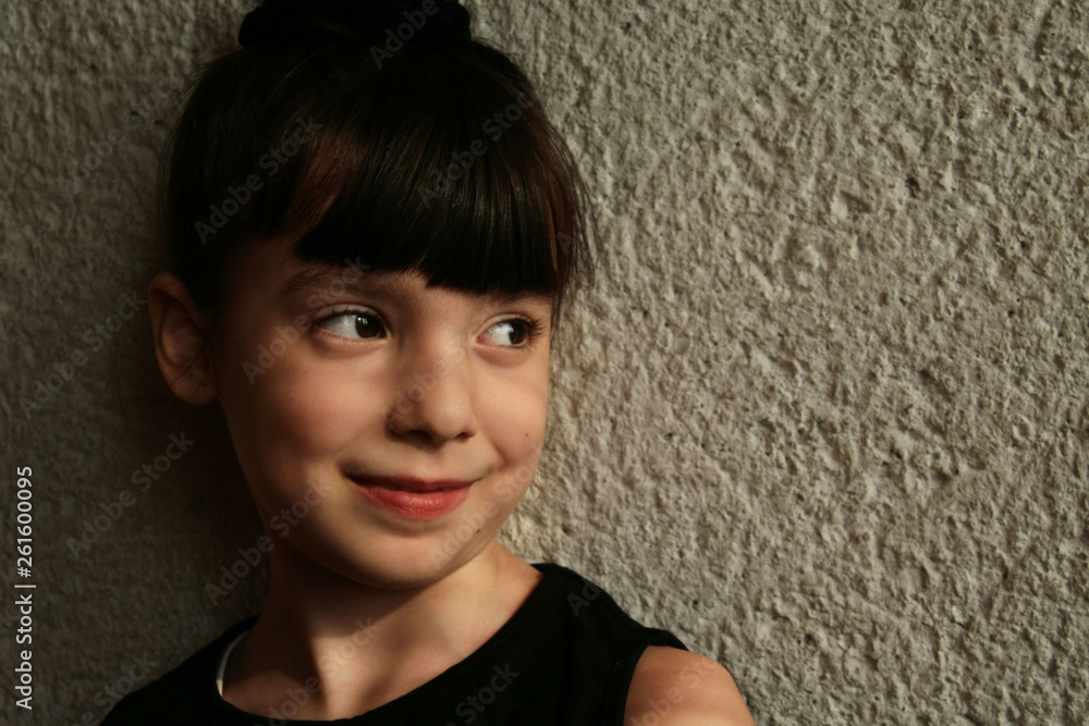 girl posing near the wall. girl posing near the wall.