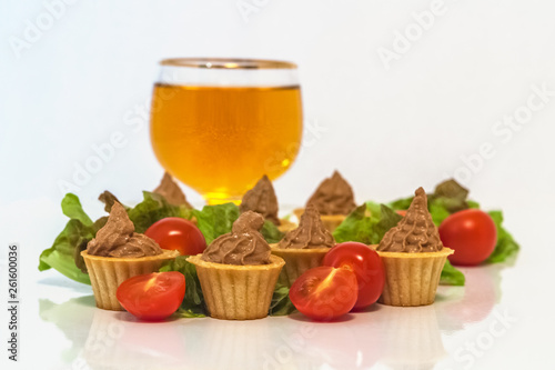 tartlets with liver pate decorated with lettuce and cherry tomatoes