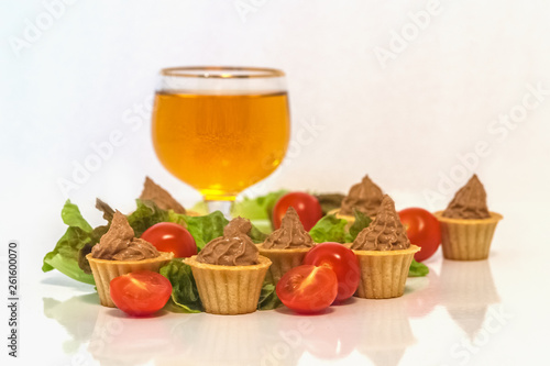 tartlets with liver pate decorated with lettuce and cherry tomatoes