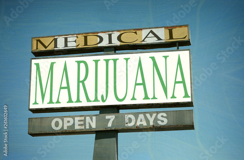 Aged and worn medical marijuana sign