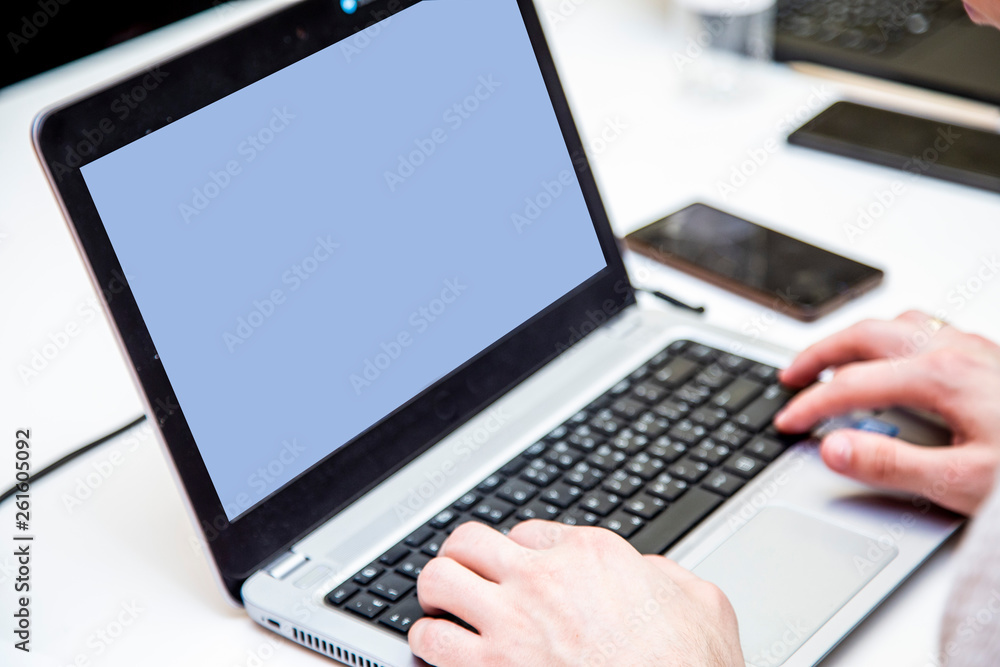 The hands of man who work for laptops, a learning process, a training session, a master class or a job are visible. The hands of man who work for laptops, a learning process, a training session, a master class or a job are visible.