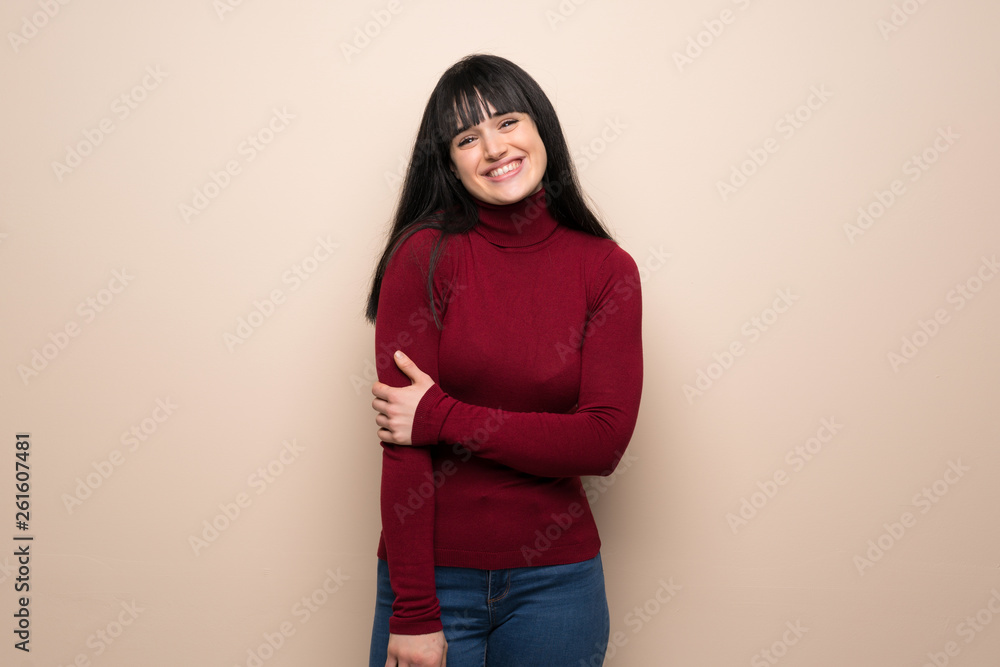 Young woman with red turtleneck With happy expression Young woman with red turtleneck With happy expression