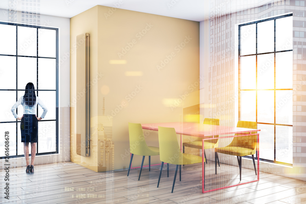 Fototapeta premium Woman in yellow and white dining room
