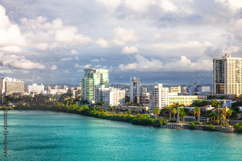 View of Condado area of San Juan Puerto Rico with bay and buildings on a day with clouds and sun. © littleny