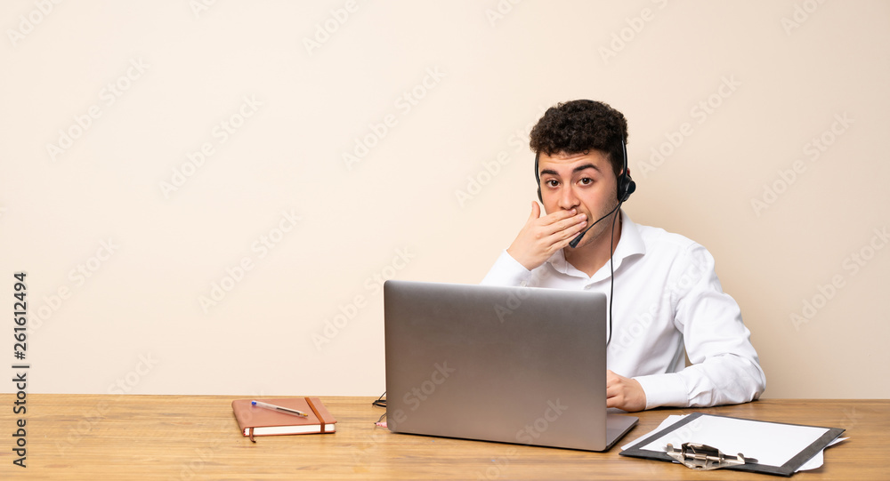 Telemarketer man covering mouth with hands Telemarketer man covering mouth with hands