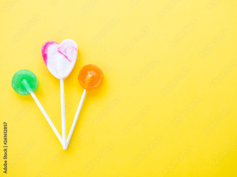 Several lollipops on a yellow background Several lollipops on a yellow background